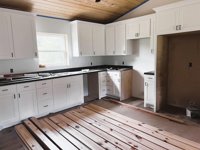 605 Frances Cv, Mountain View, AR 72560 - kitchen featuring wood ceiling, light wood-type flooring, vaulted ceiling, white cabinetry, and dark countertops