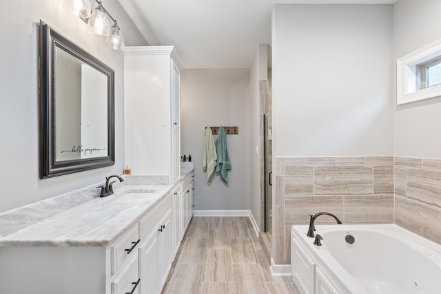 bathroom featuring vanity and plus walk in shower