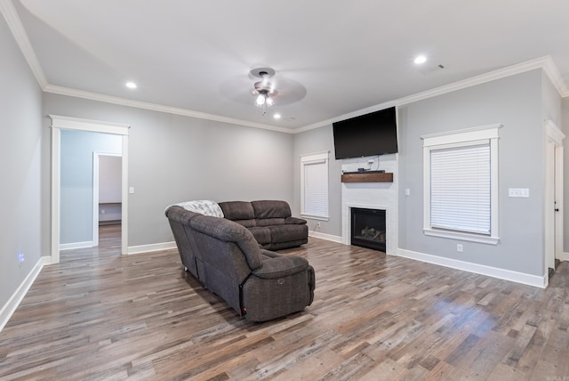 living room with ornamental molding and hardwood / wood-style floors