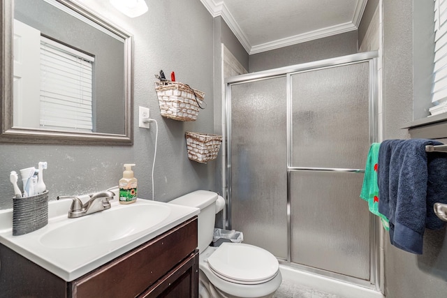 bathroom with crown molding, vanity, toilet, and a shower with shower door