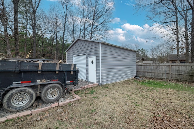 garage featuring a lawn