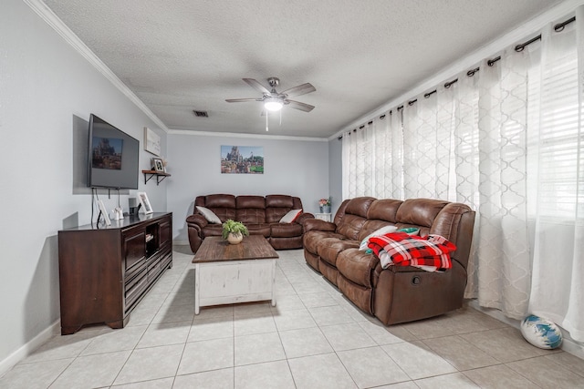 living room featuring crown molding, light tile patterned floors, and a textured ceiling