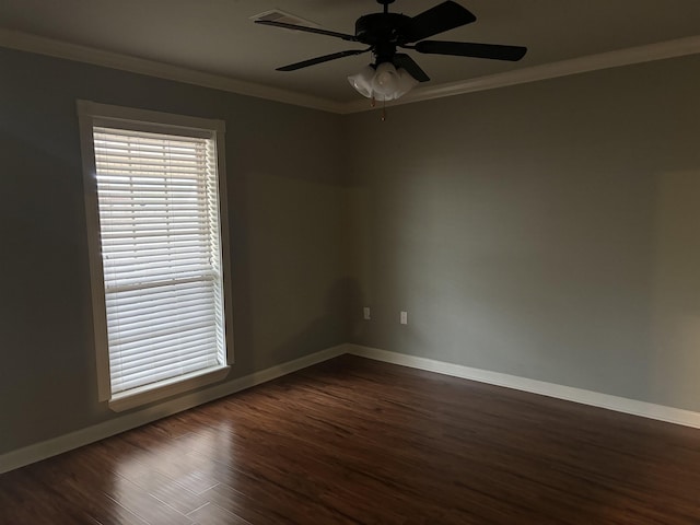 unfurnished room featuring crown molding, dark wood-type flooring, and ceiling fan