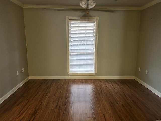 spare room with ornamental molding, dark wood-type flooring, and ceiling fan