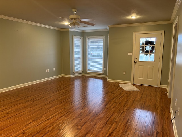 foyer entrance featuring ceiling fan, ornamental molding, and dark hardwood / wood-style floors