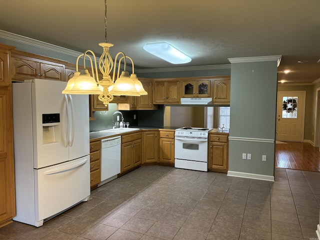 kitchen featuring sink, hanging light fixtures, ornamental molding, dark tile patterned flooring, and white appliances