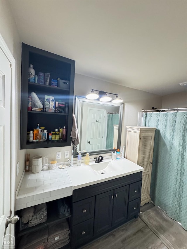 bathroom featuring vanity and wood-type flooring