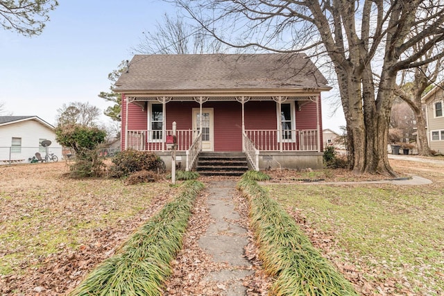 view of front facade with a porch and a front yard