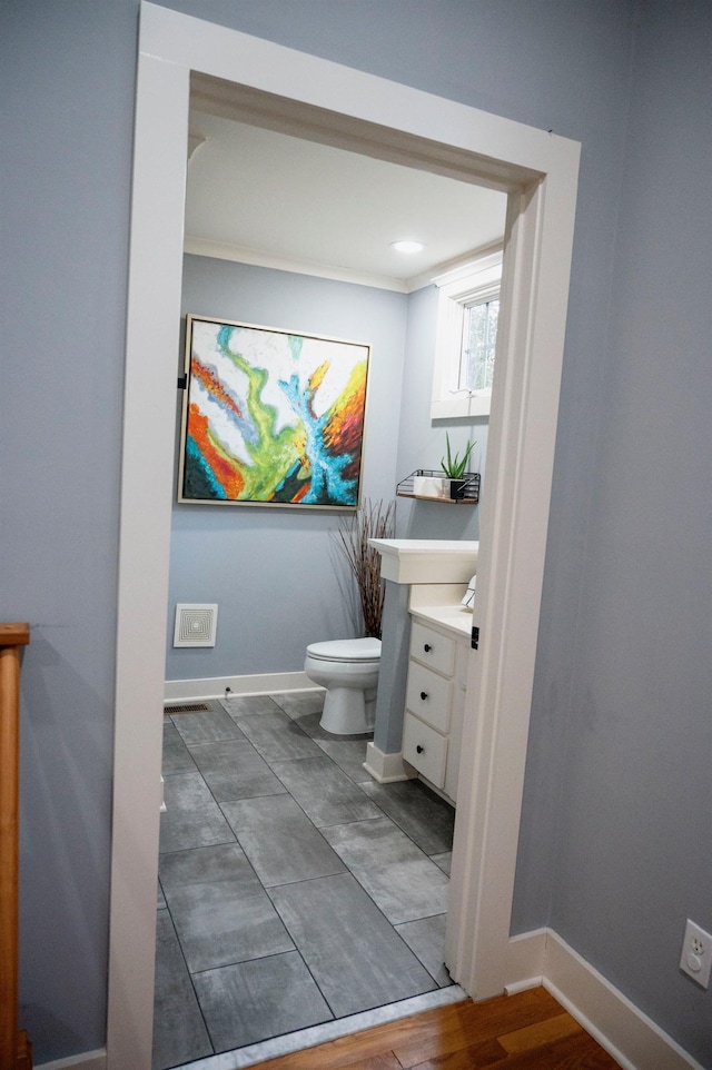 bathroom featuring vanity and toilet