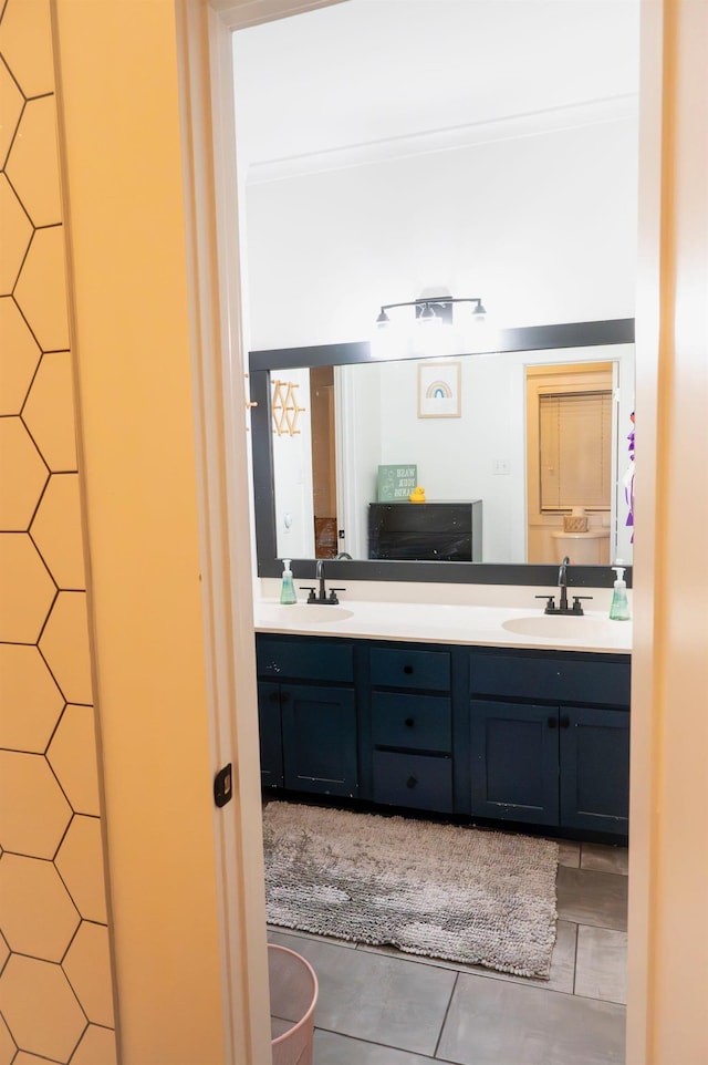 bathroom with tile patterned floors and vanity