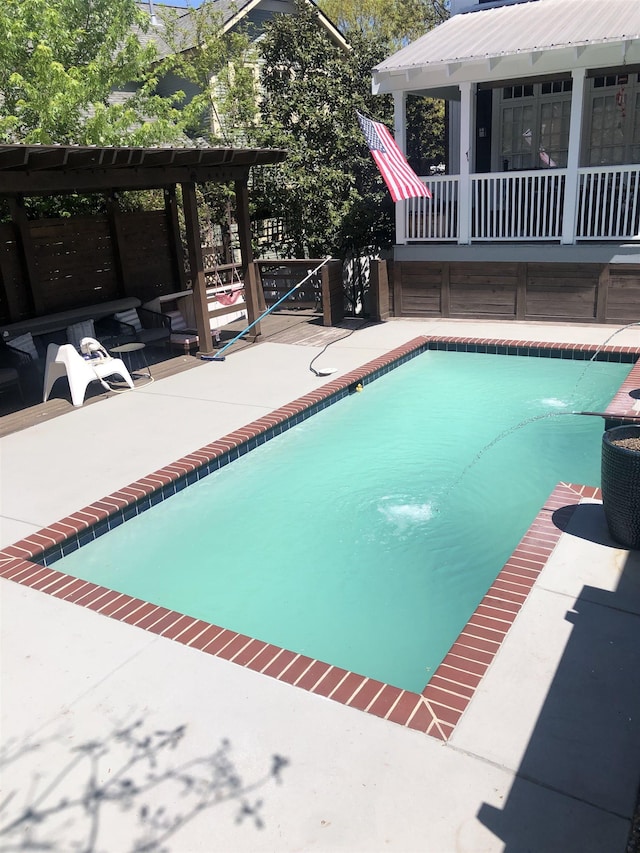 view of swimming pool with a patio