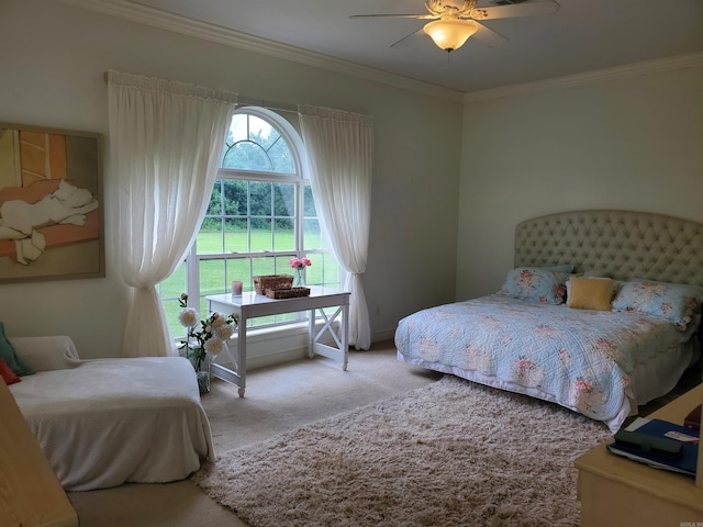 bedroom with ceiling fan, ornamental molding, and carpet floors