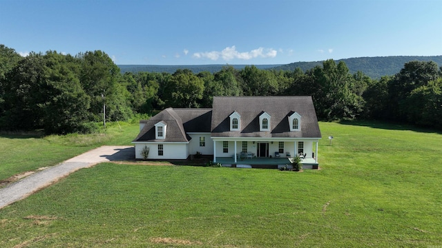 cape cod house with a porch and a front yard