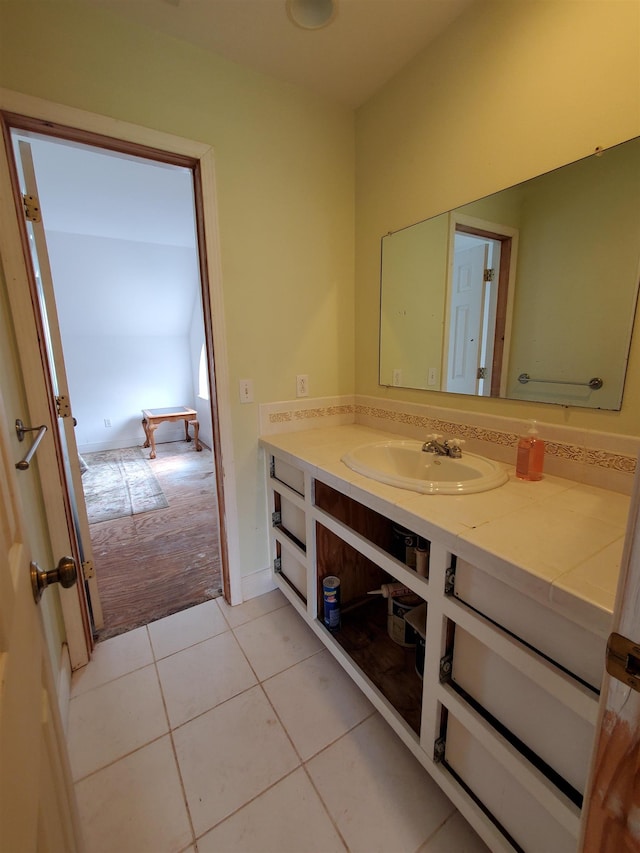 bathroom with tile patterned flooring and vanity