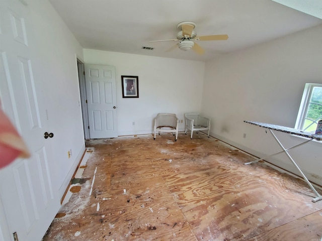 unfurnished room with ceiling fan