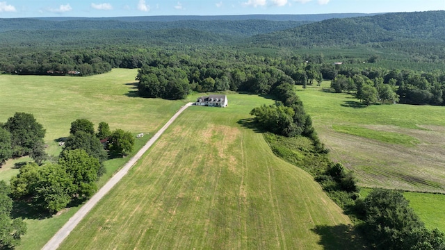 birds eye view of property with a rural view