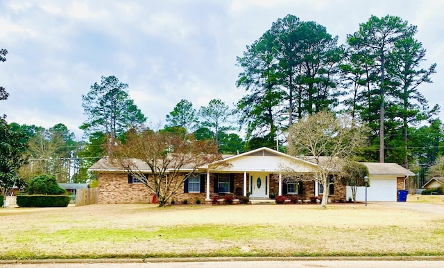 ranch-style house with a garage and a front lawn