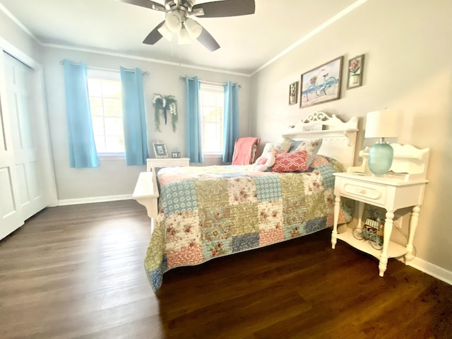 bedroom featuring ornamental molding, dark hardwood / wood-style floors, ceiling fan, and a closet