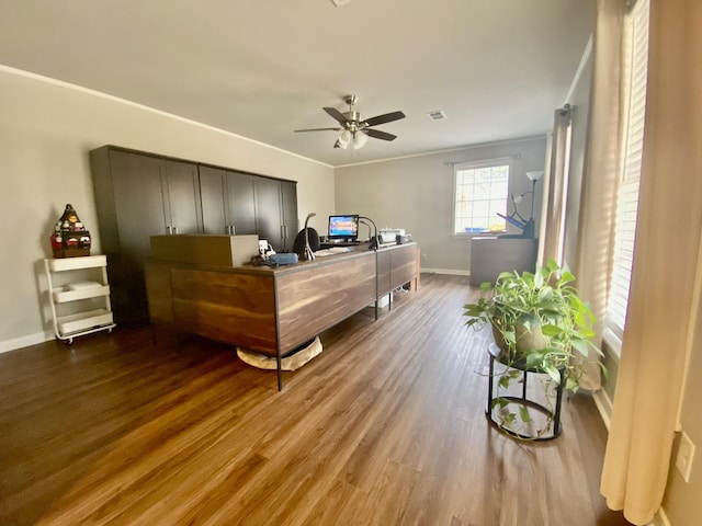 interior space with ceiling fan