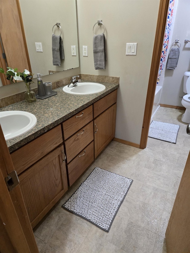 full bathroom featuring shower / bathtub combination, vanity, and toilet