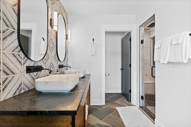 bathroom with vanity and a shower with shower door