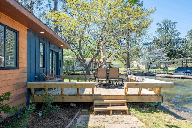 wooden terrace with a water view