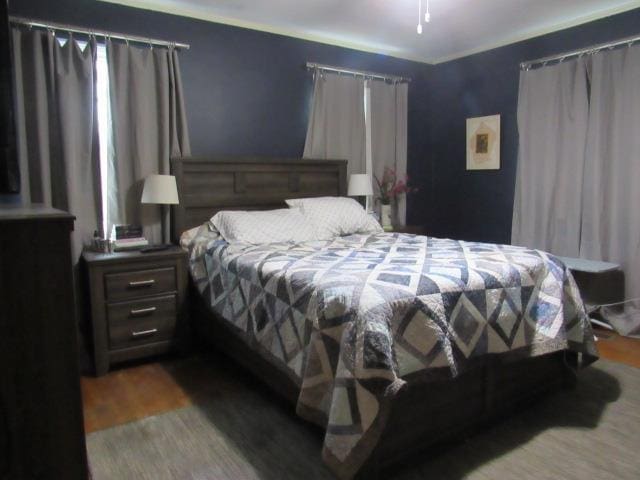 bedroom with light hardwood / wood-style floors