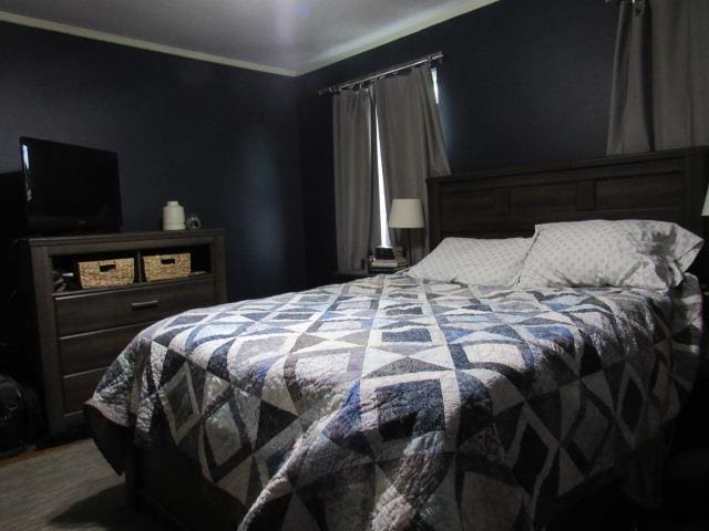 bedroom featuring ornamental molding