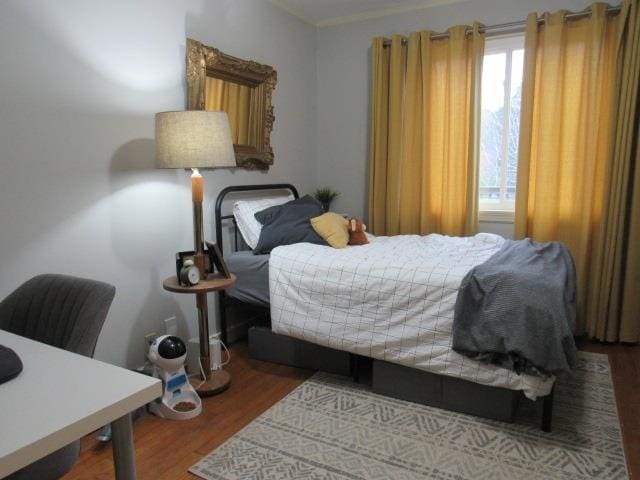 bedroom featuring hardwood / wood-style floors