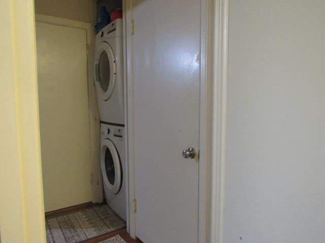 washroom with stacked washer / drying machine