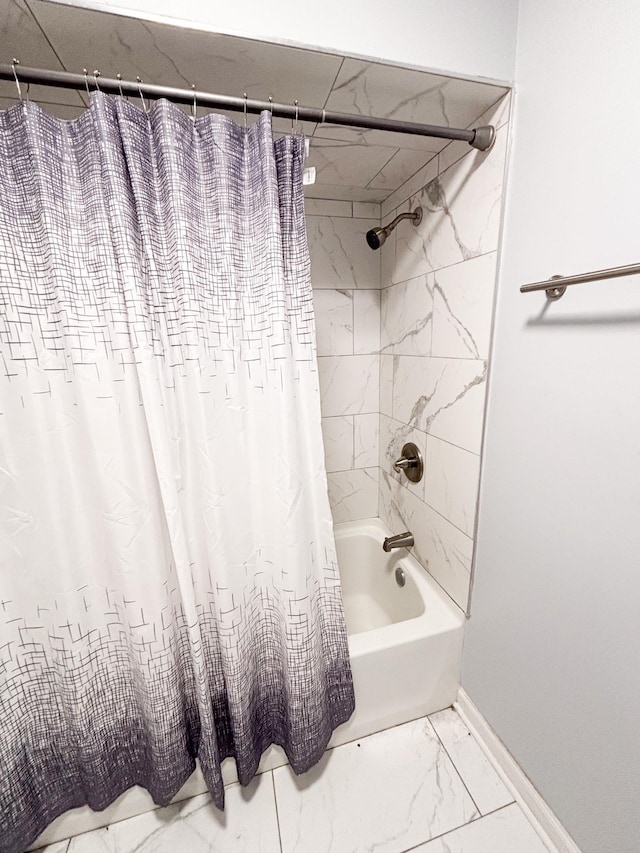 bathroom with shower / tub combo with curtain