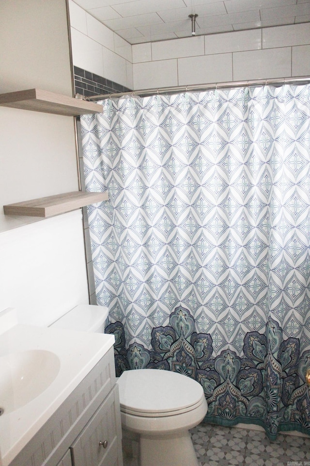 bathroom with vanity and toilet