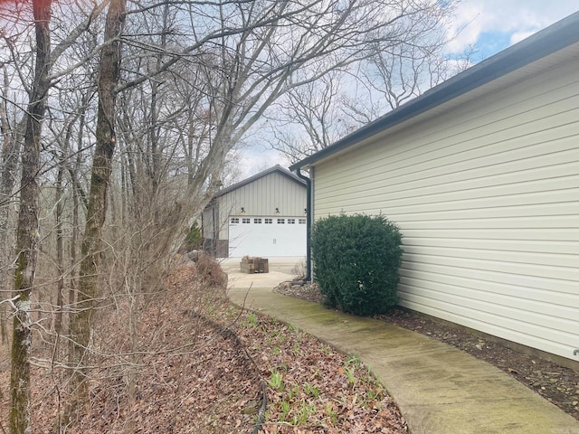 view of home's exterior featuring a garage and an outdoor structure