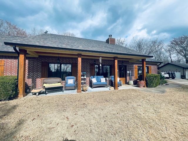 back of house with an outdoor hangout area and a patio area