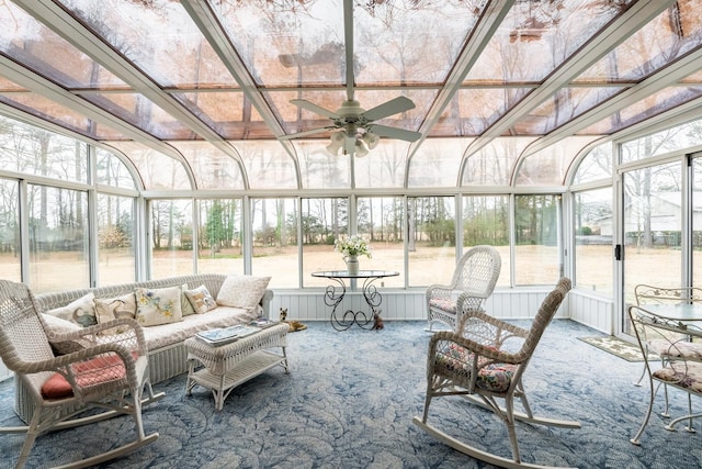 sunroom featuring ceiling fan and a healthy amount of sunlight