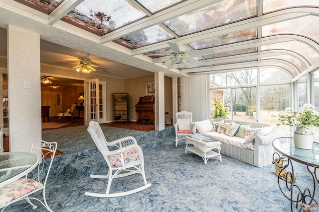 sunroom / solarium with coffered ceiling, beamed ceiling, french doors, and ceiling fan