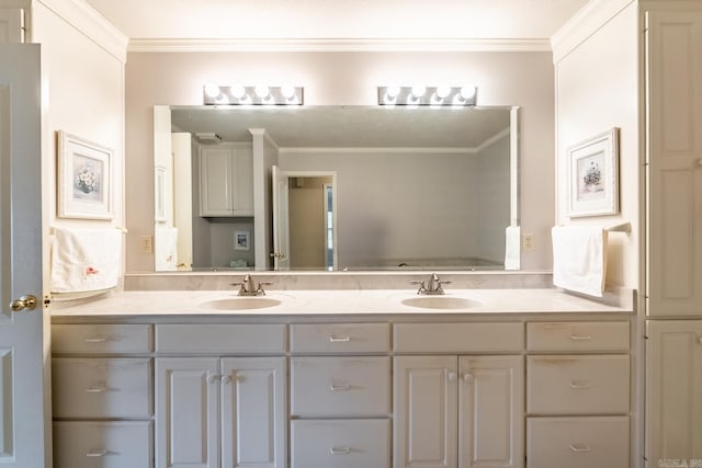 bathroom with vanity and ornamental molding