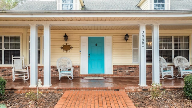 entrance to property featuring a porch