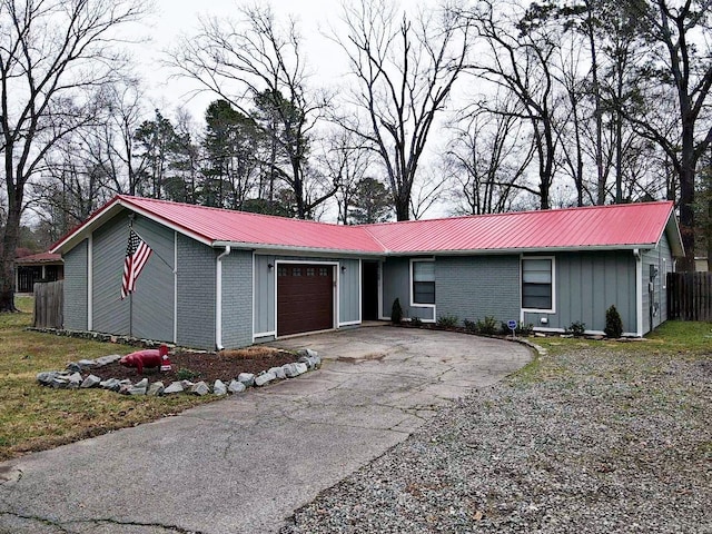 ranch-style home featuring a garage