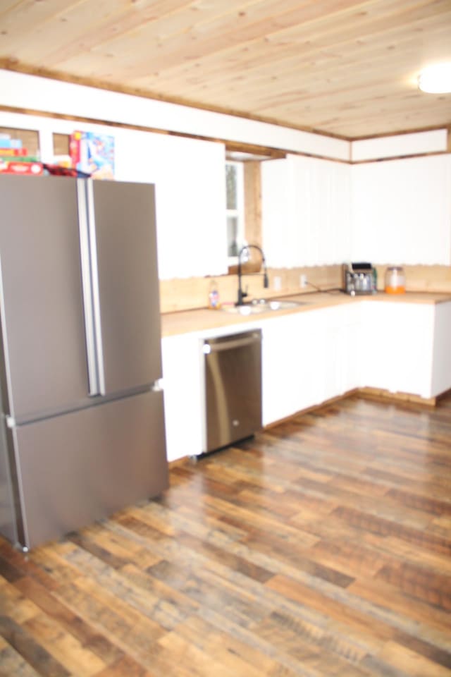 kitchen with sink, white cabinetry, wood ceiling, appliances with stainless steel finishes, and dark hardwood / wood-style floors