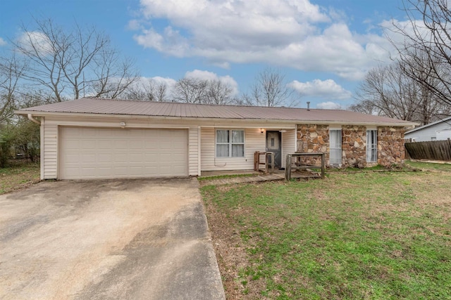 ranch-style house featuring a garage and a front lawn