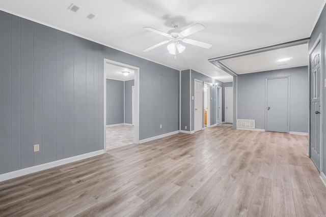 spare room featuring ceiling fan and light wood-type flooring