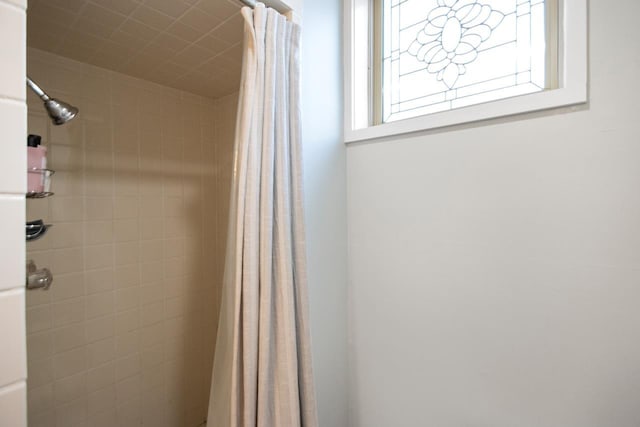 bathroom with a shower with shower curtain