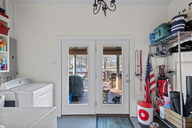 laundry area with hardwood / wood-style flooring and washer and dryer