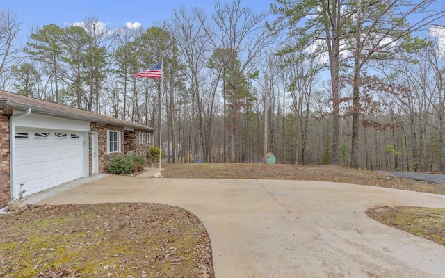 view of patio / terrace featuring a garage