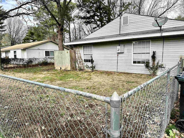 view of side of property with a lawn