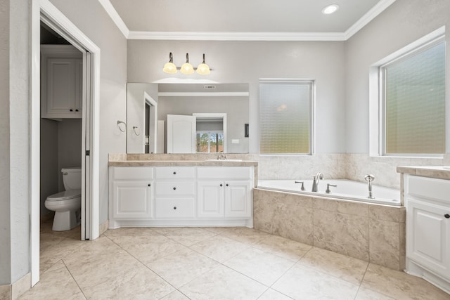 bathroom featuring vanity, tiled tub, ornamental molding, and toilet