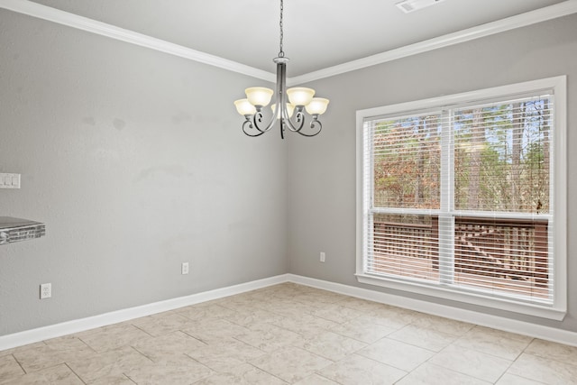 empty room featuring ornamental molding and a chandelier