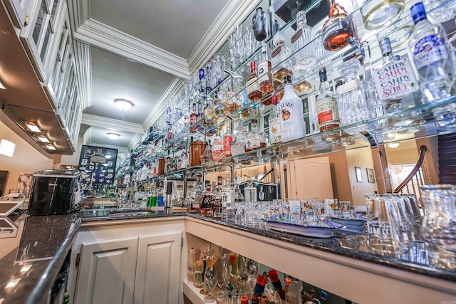 interior space with indoor bar and ornamental molding