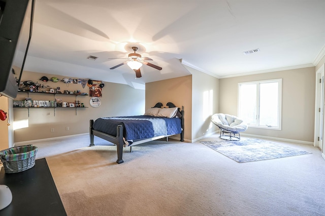 carpeted bedroom featuring ornamental molding and ceiling fan